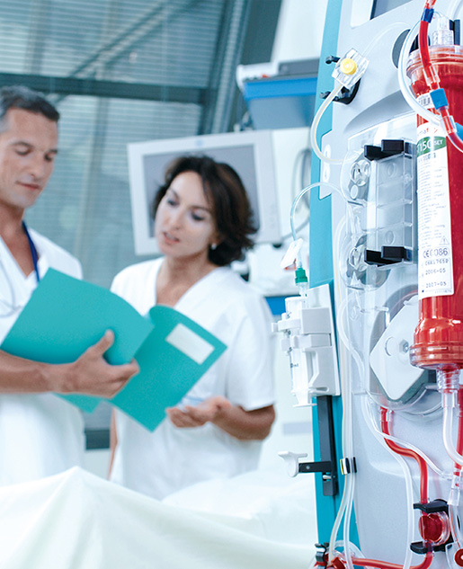 PRISMAFLEX System closeup with Doctor showing Nurse a patient file in background.