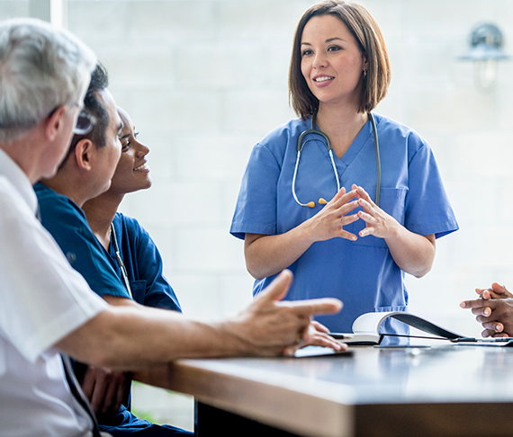 Nurse talking with Doctors and other healthcare professionals